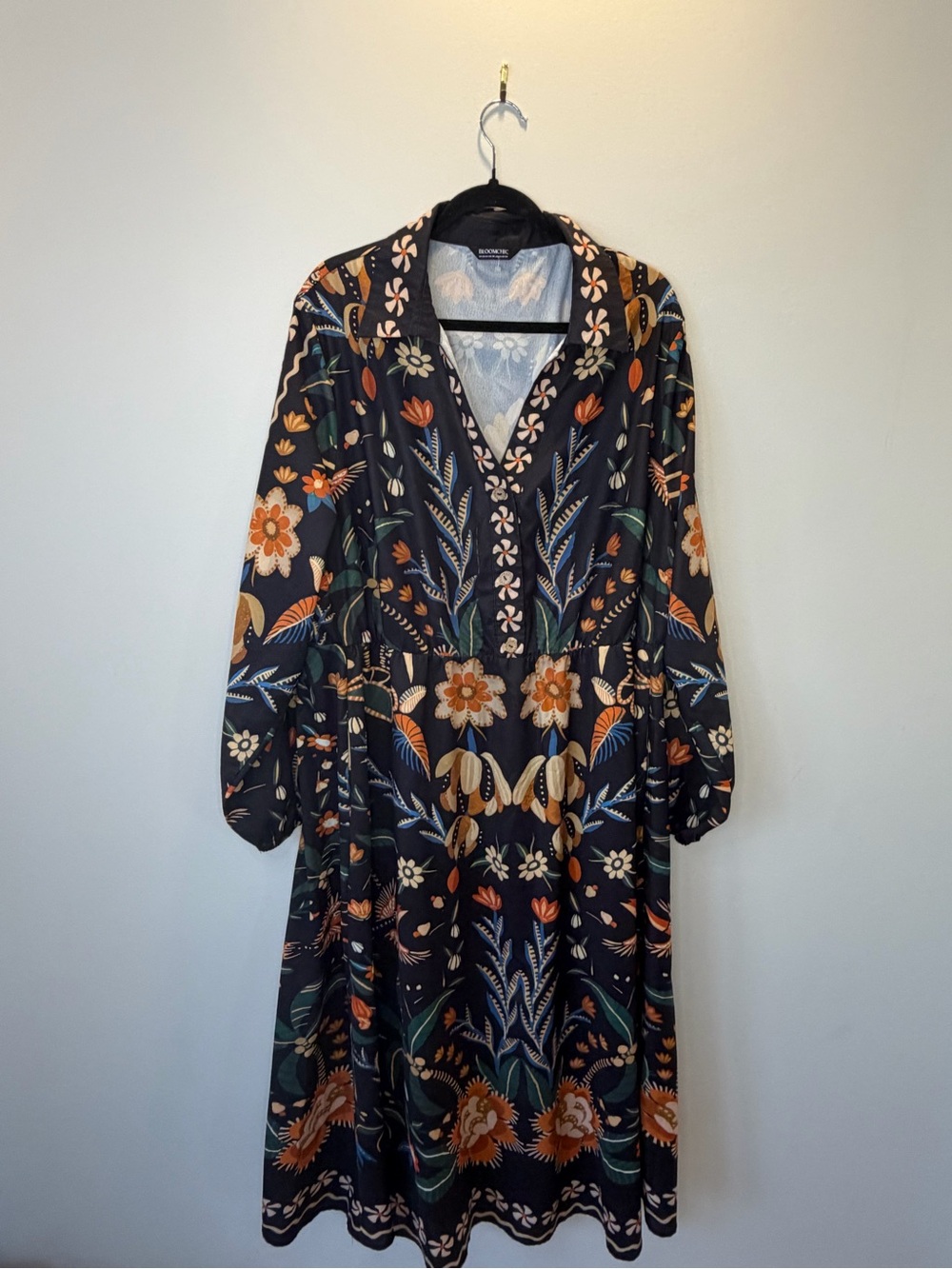 BloomChic Black Floral V-Neck Midi Dress with Orange and Green Motifs